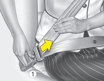 To release the seat belt: