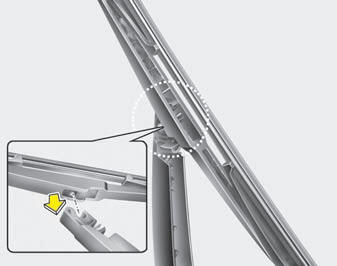 2. Install the new blade assembly by inserting the center part into the slot